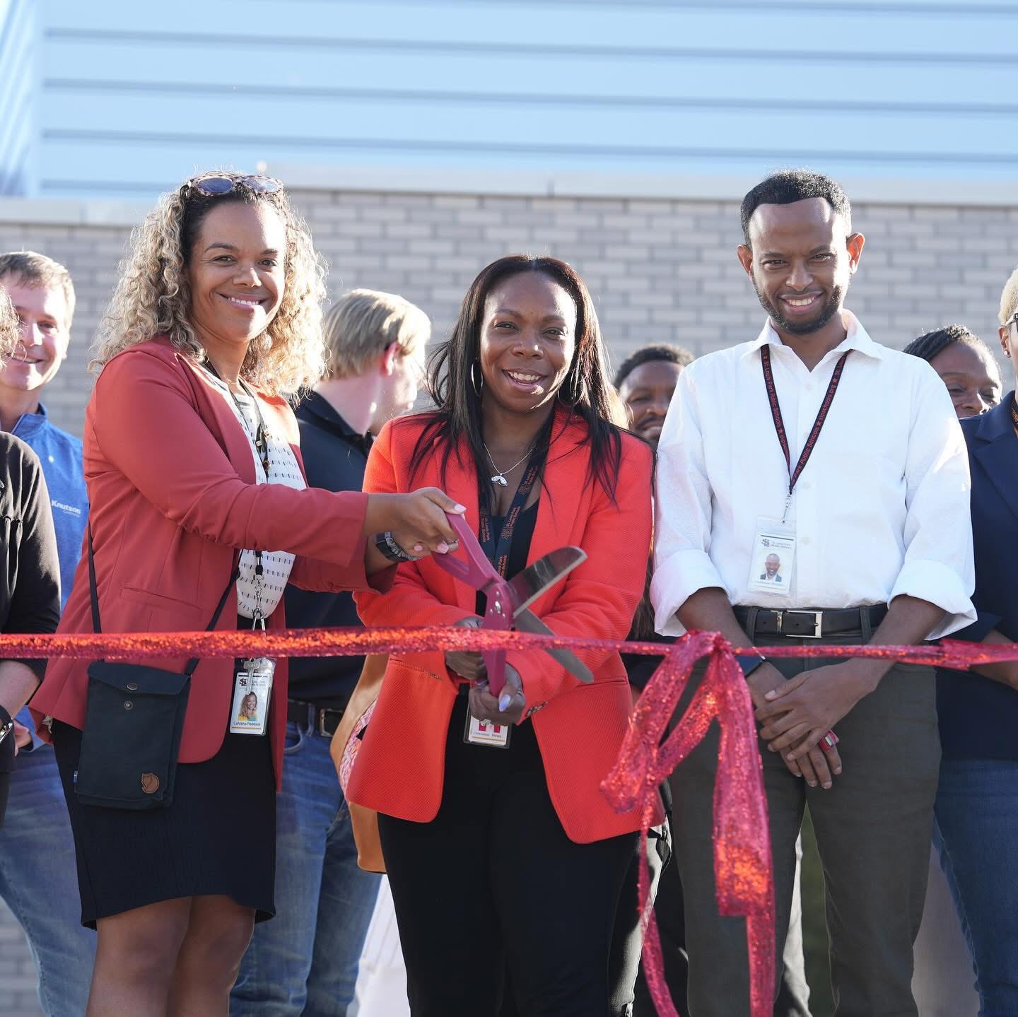 Abdihakim at a ribbon-cutting ceremony